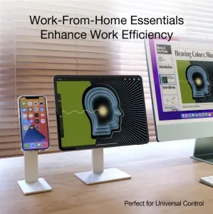 Just Mobile AluDisc Pro iPhone-Ständer in einem Schreibtischaufbau, der ein iPhone aufrecht neben einem Tablet und einem Monitor hält