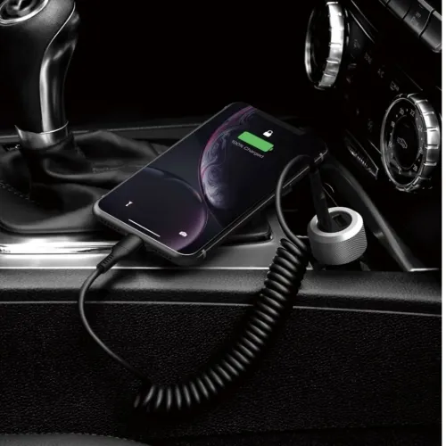 Just Mobile Highway Turbo aluminum car charger in the 12V socket with helical cable that charges the smartphone in the center console.